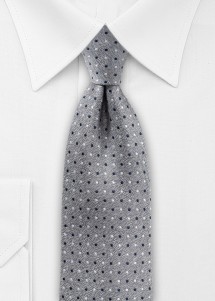 Cravatta grigia in look denim con pois blu...