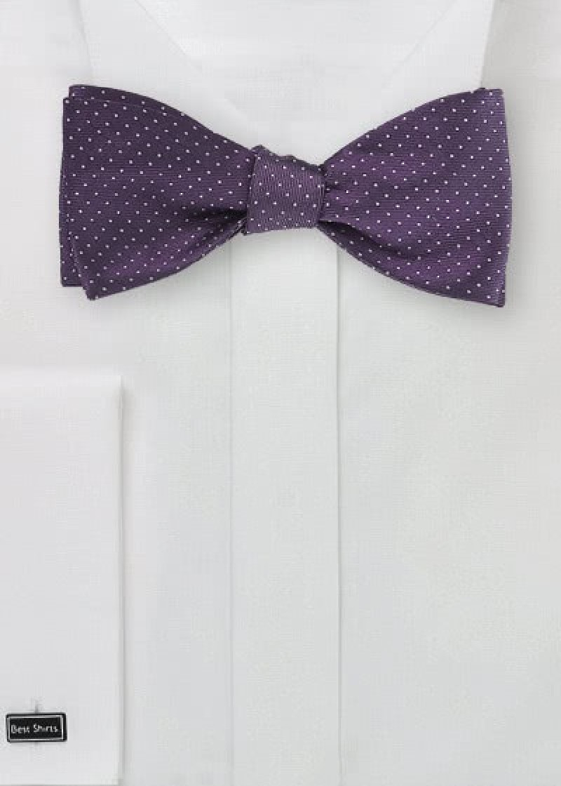 Papillon viola pois